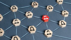Hexagons with businessmen employees are connected with their leader by a business network. Communication and social networks. 